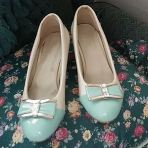 Patent leather pumps.